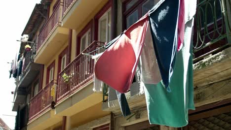 some laundry hanging for drying on the street of porto, portugal