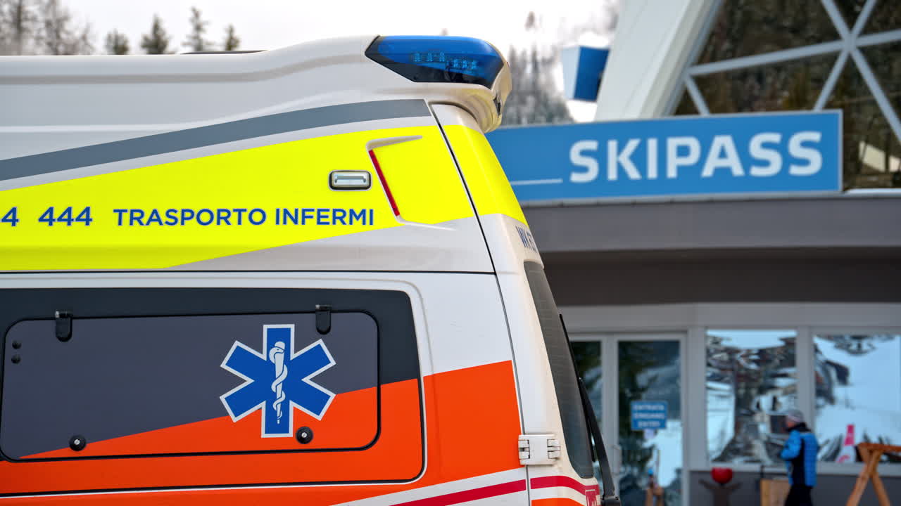 Close up of an ambulance in front of a cabin at a ski resort in the Dolomites, Italy