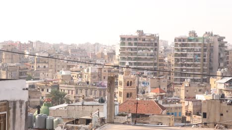 panning shot of middle eastern apartment buildings in an arab city in tripoli, northern lebanon