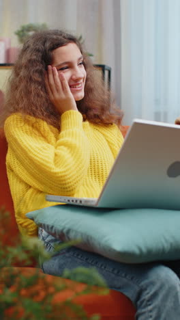 amazed teen girl use laptop computer receive good news message shocked by victory celebrate win