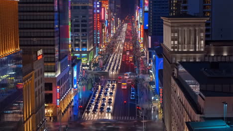 vibrant city street at night with neon lights and traffic