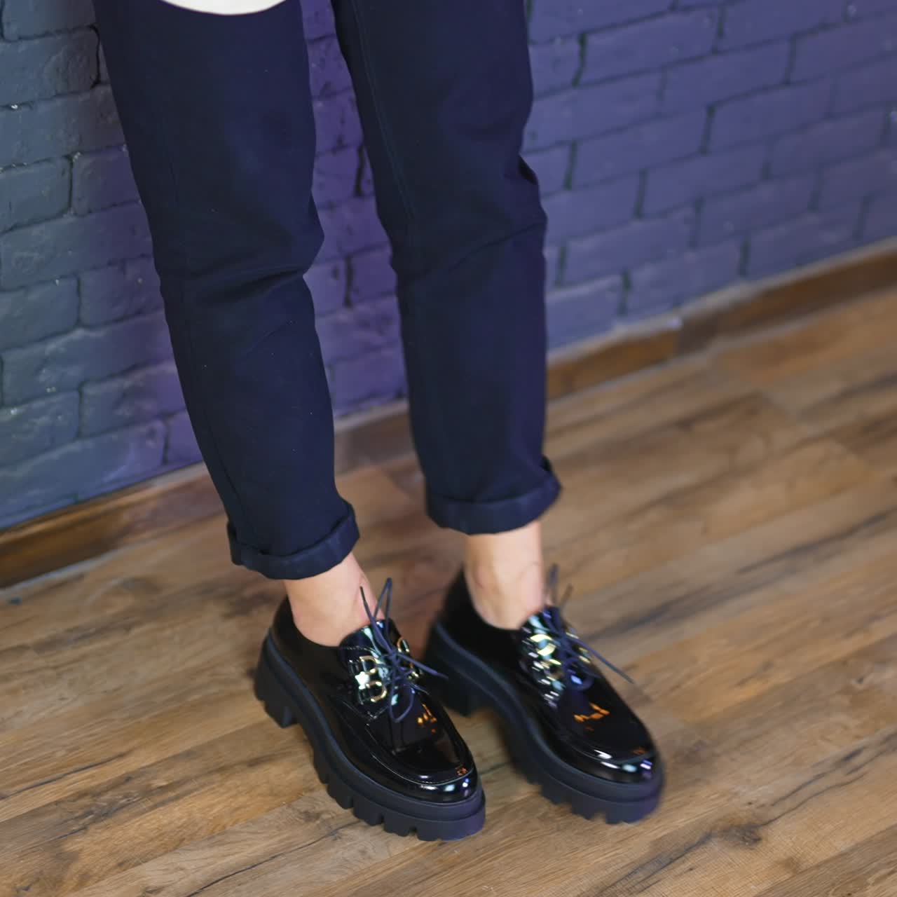 Slow motion lifestyle stylish footwear. Close up view of shoes on the floor