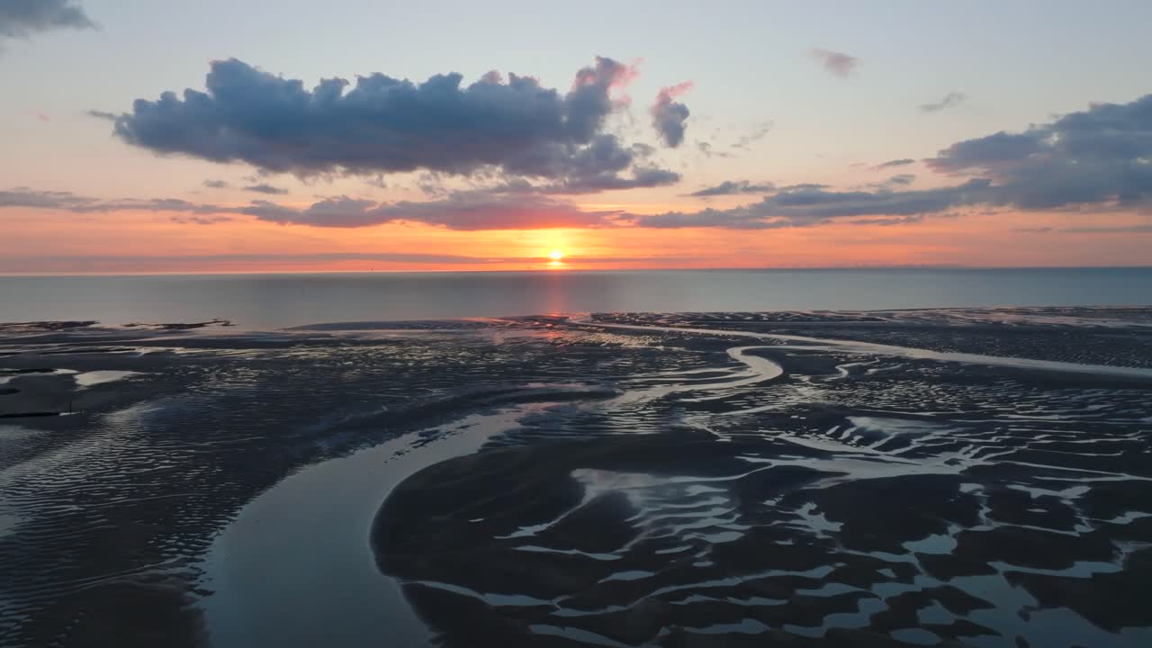 Colourful Sunset Over The Irish Sea Over Tidal Sand Flats With Intricate Sand Patterns And Inlets. Golden Hour. Fleetwood, Lancashire, UK