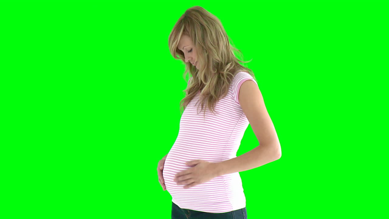  young future mom standing against green screen