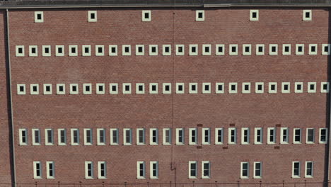 brick wall with multiple rows of windows