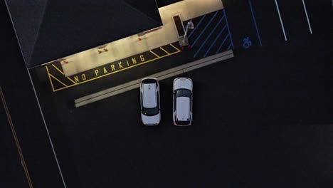 Overhead-descending-Birdseye-view-of-cars-parked