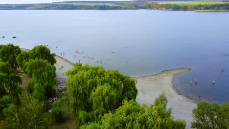 lake side beach with people relaxing