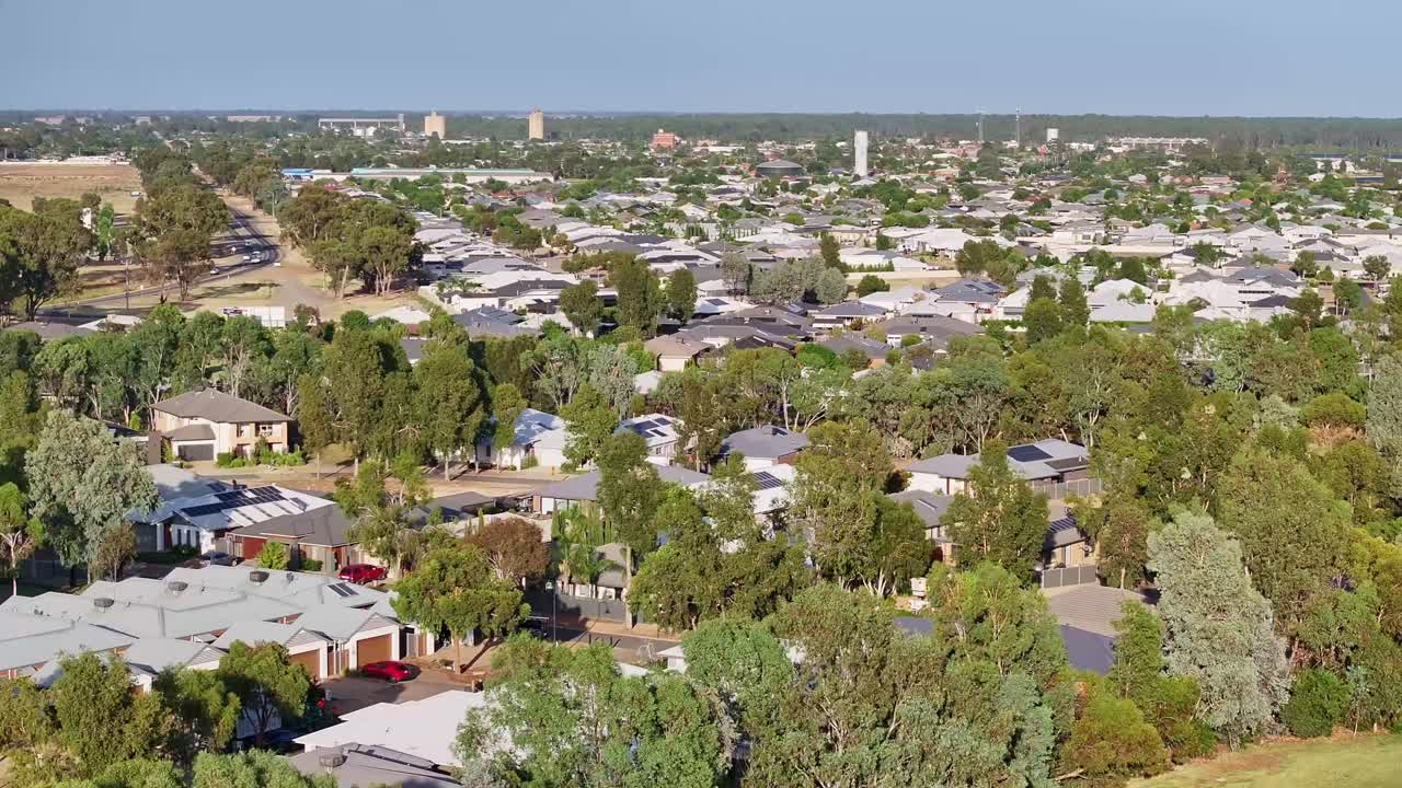 Suburban homes nestled amidst lush greenery near open fields in Yarrawonga Victoria Australia