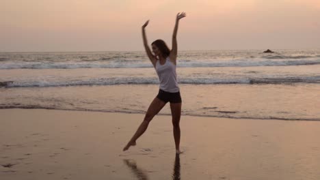 pretty sportive girl doing cartwheels on the beach