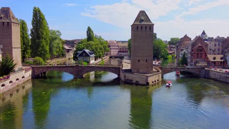 the covered canal bridge over the river ill in petite france, strasbourg, france