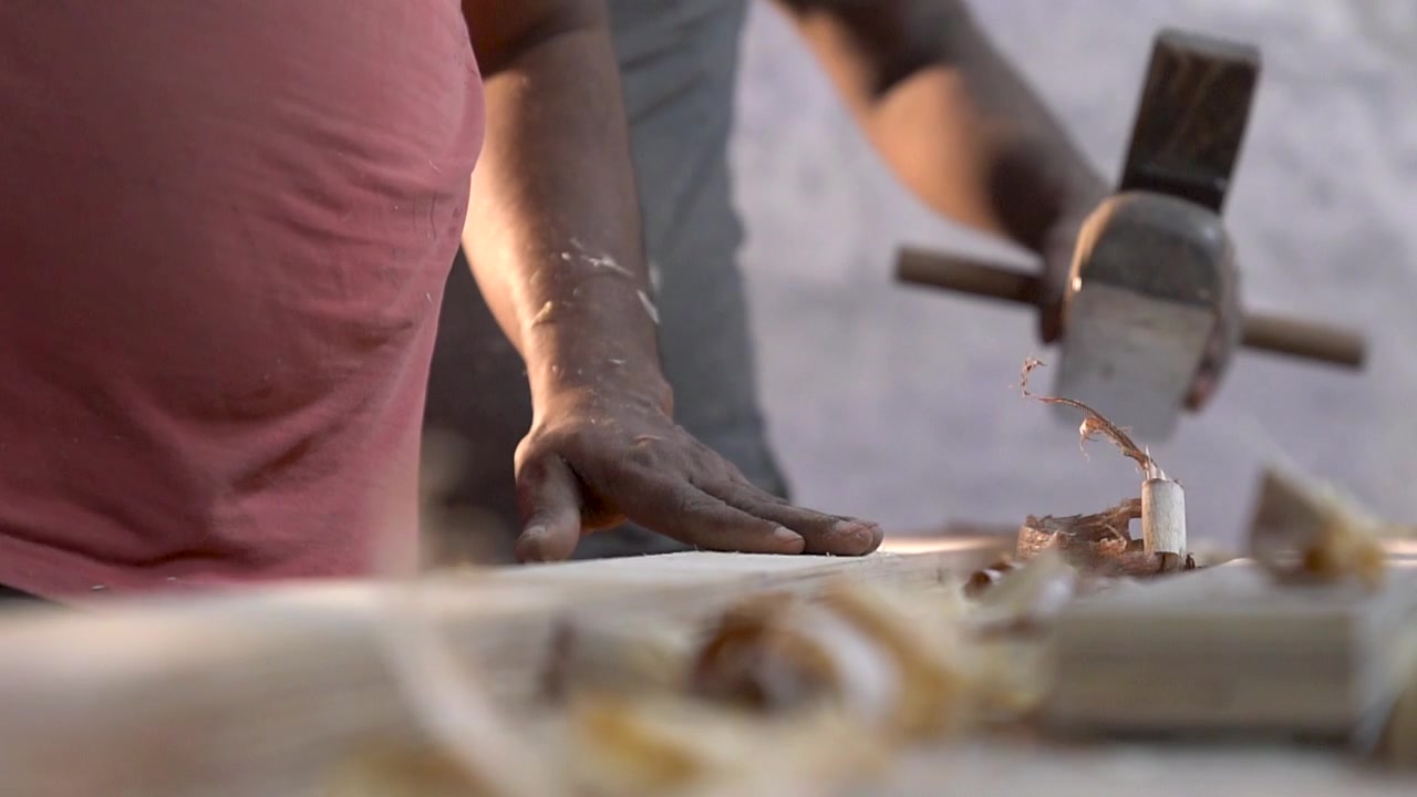 Woodworker Touching The Surface Of A Wood Plank On The Planing Table - extreme close up slowmo