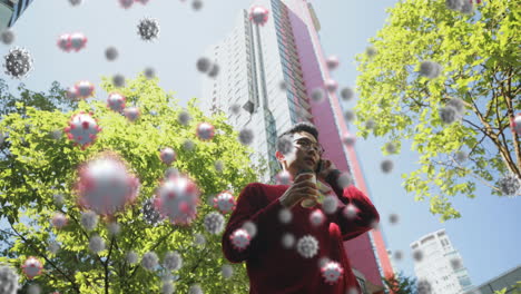 coronavirus cells spreading over man on phone.