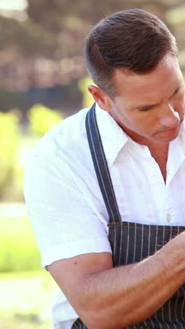 farmer man tidying up a table of local food