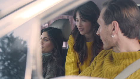 husband and wife sitting in the front seats of a car 3