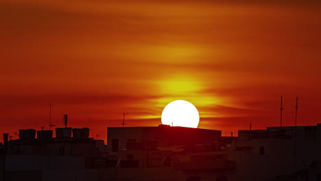 Timelapse-of-orange-sunset-above-Gzira,-Malta