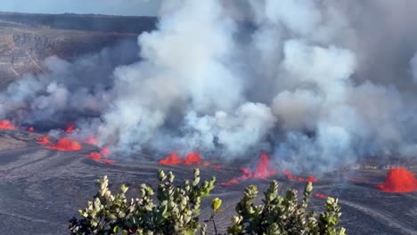 Cinematic long lens panning shot of lava and volcanic gasses shooting out of Kilauea a few hours after it began erupting in September 2023 on the Big Island of Hawai&#039;i