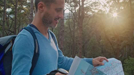 male traveler reading map