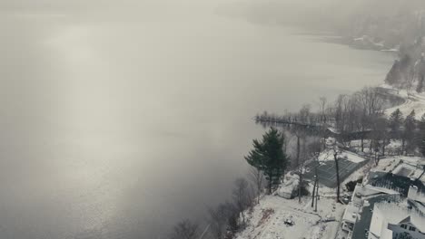 manoir hovey hotel by the lakeshore of massawippi during snowy winter day in north hatley québec, canada