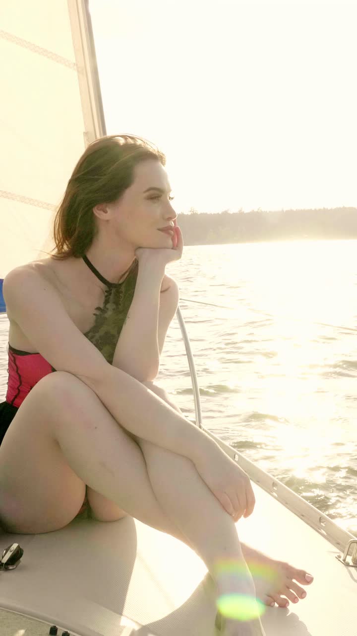 Woman Sailing at Sunset