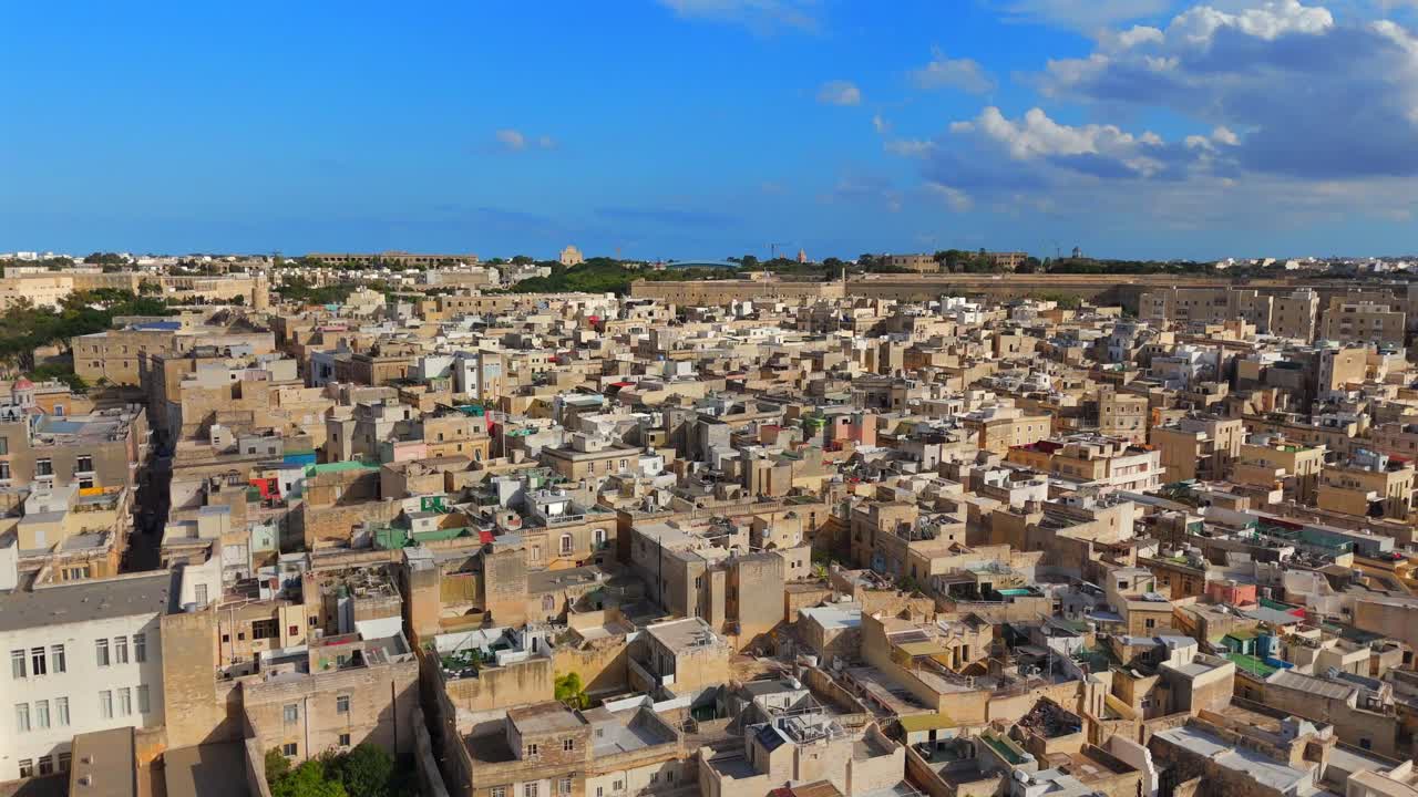 Birgu’s blend of medieval and baroque architecture is beautifully highlighted from above, nestled between the sea and its towering walls.