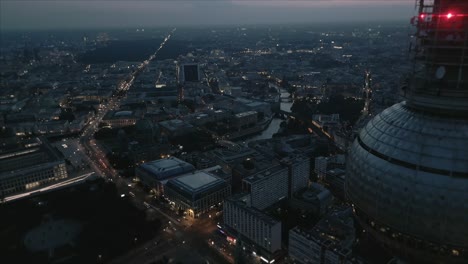 Cinematic-Night-Drone-reveal-shot-of-Berlin-TV-tower-Landmark-in-Germany