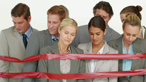 business people surrounding by red strip