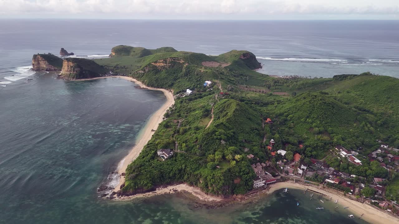 Aerial view of coastline at Gerupuk Beach on hilly Lombok island, IDN