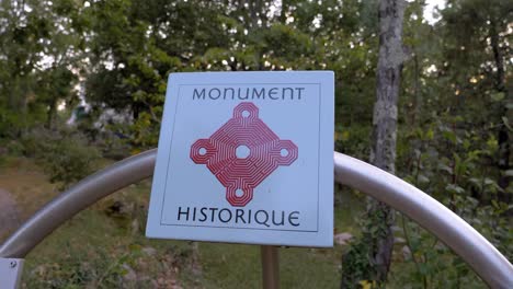 the white and red signage of a historic monument: a symbol of identity, recognition, and civic engagement