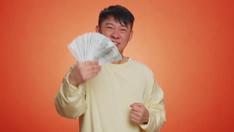 rich pleased boss man waving money dollar cash, success business career, lottery winner big income