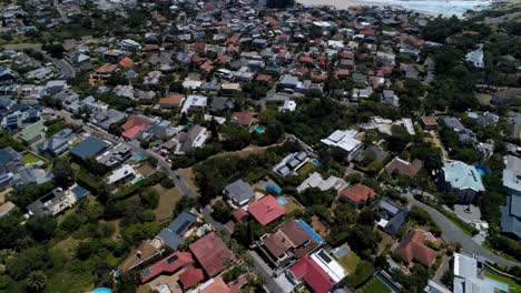 General-view-of-cityscape-with-houses,-mountains,-sea-and-blue-sky