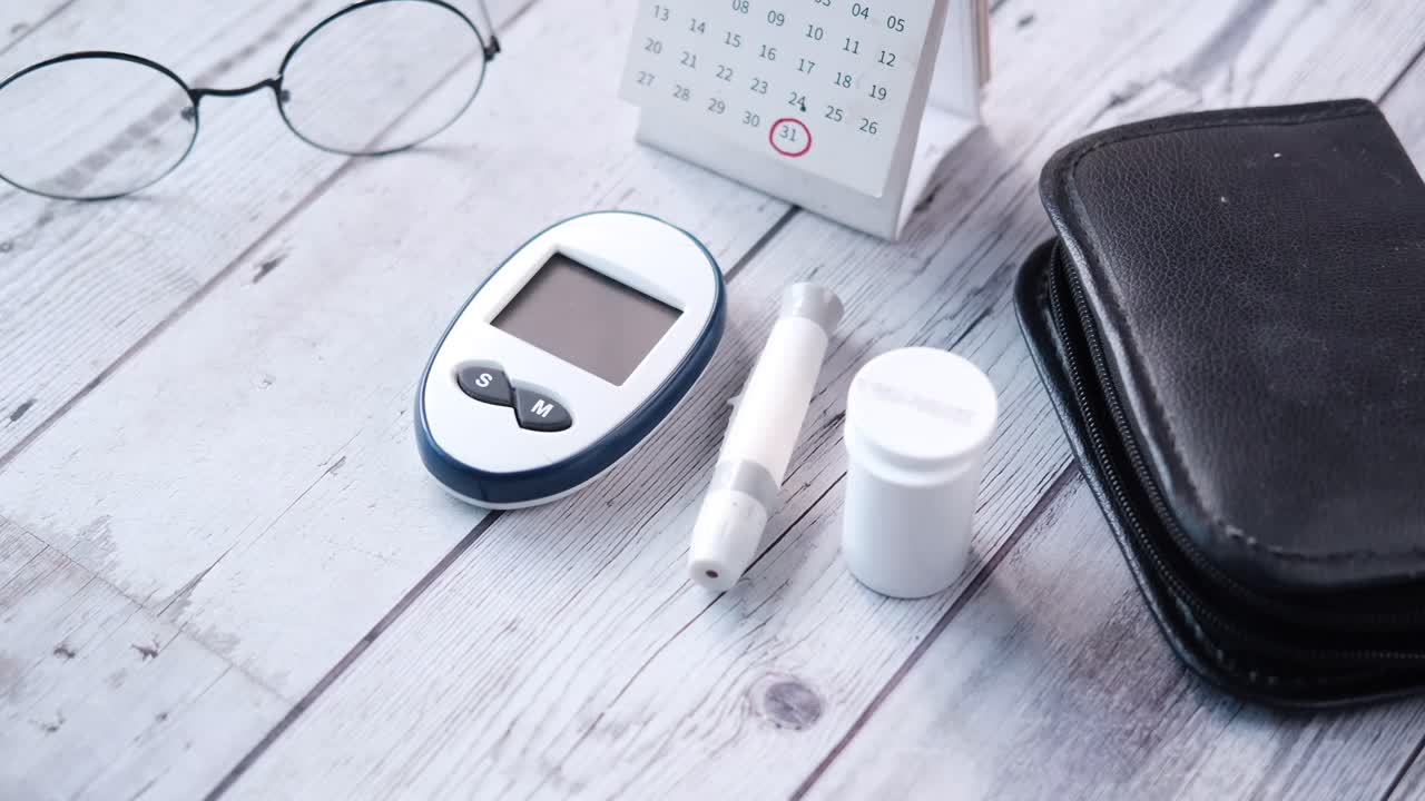 Diabetes Management Supplies on a Wooden Table