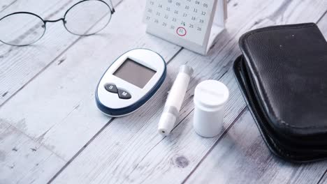 diabetes management supplies on a wooden table