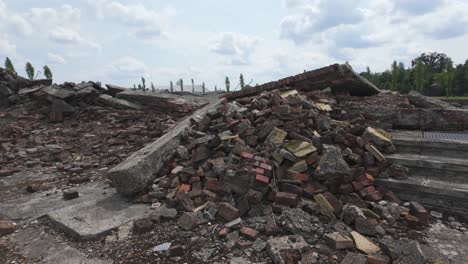 ruins of auschwitz-birkenau concentration camp, featuring broken concrete and rubble. poland