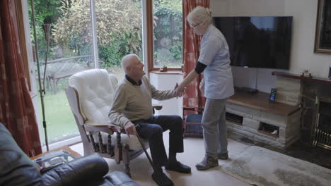 elderly man receiving assistance at home