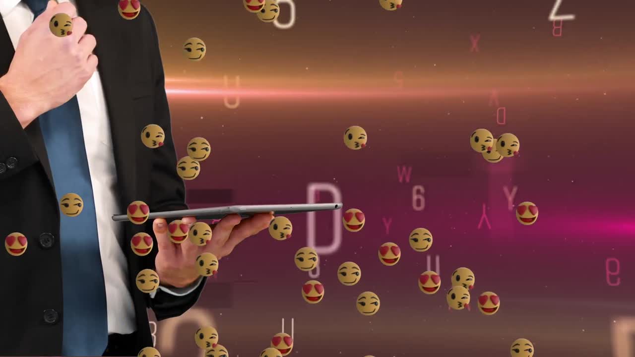 태블릿을 들고 있는 백인 남자의 손과 글자를 바꾸는 에모지들의 애니메이션