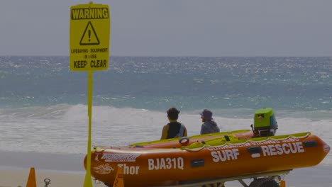 rescue team preparing boat on beach