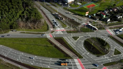 aerial: large roundabout with intersections in city