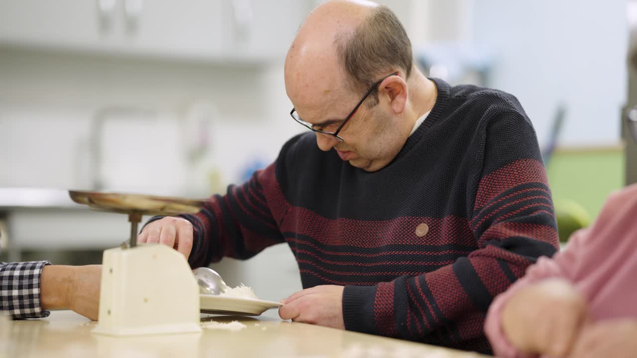 A man is portioning food with a scale