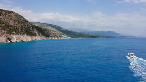 Drone-shot-flying-over-the-Albanian-Riviera-coast-on-sunny-summer-day