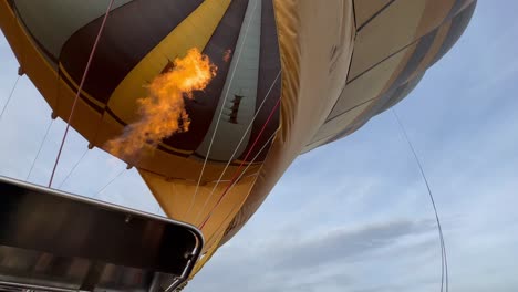 hot air balloon is being prepared for takeoff. serengeti national park in tanzania.