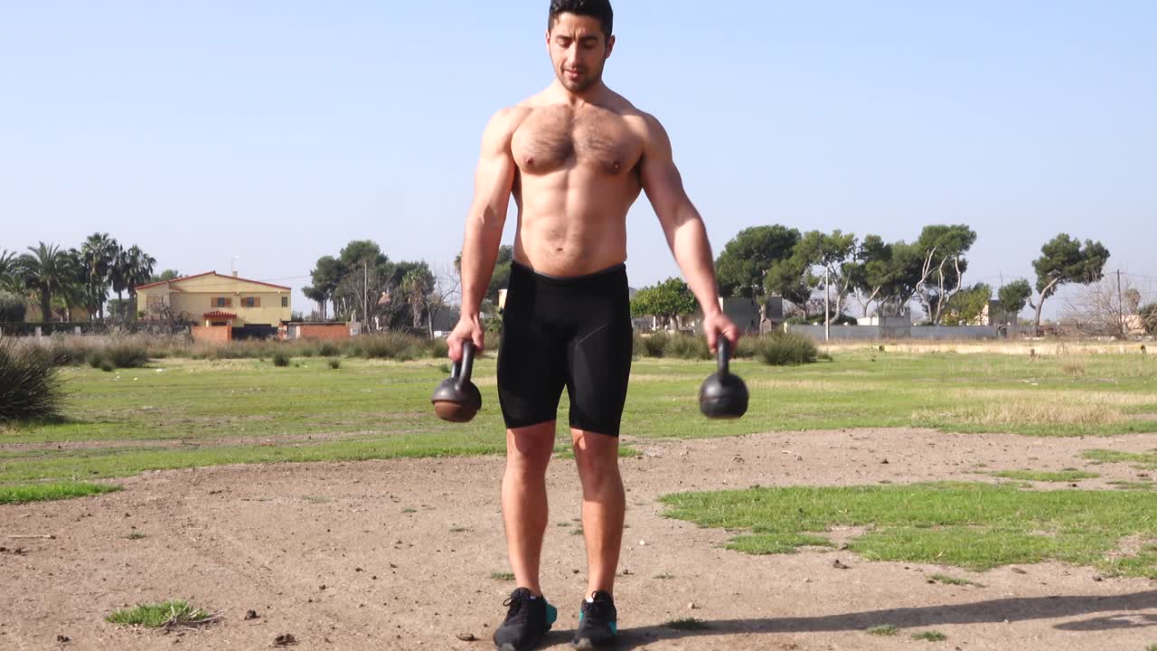functional training of all muscle groups with kettlebells and outdoors