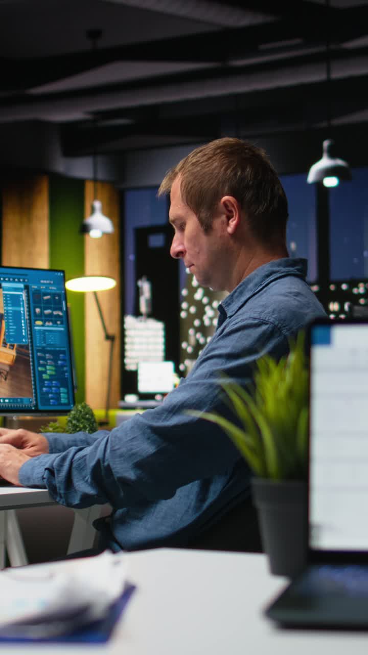 Vertical Video Male employee creates 3D render of an apartment interior using blueprints