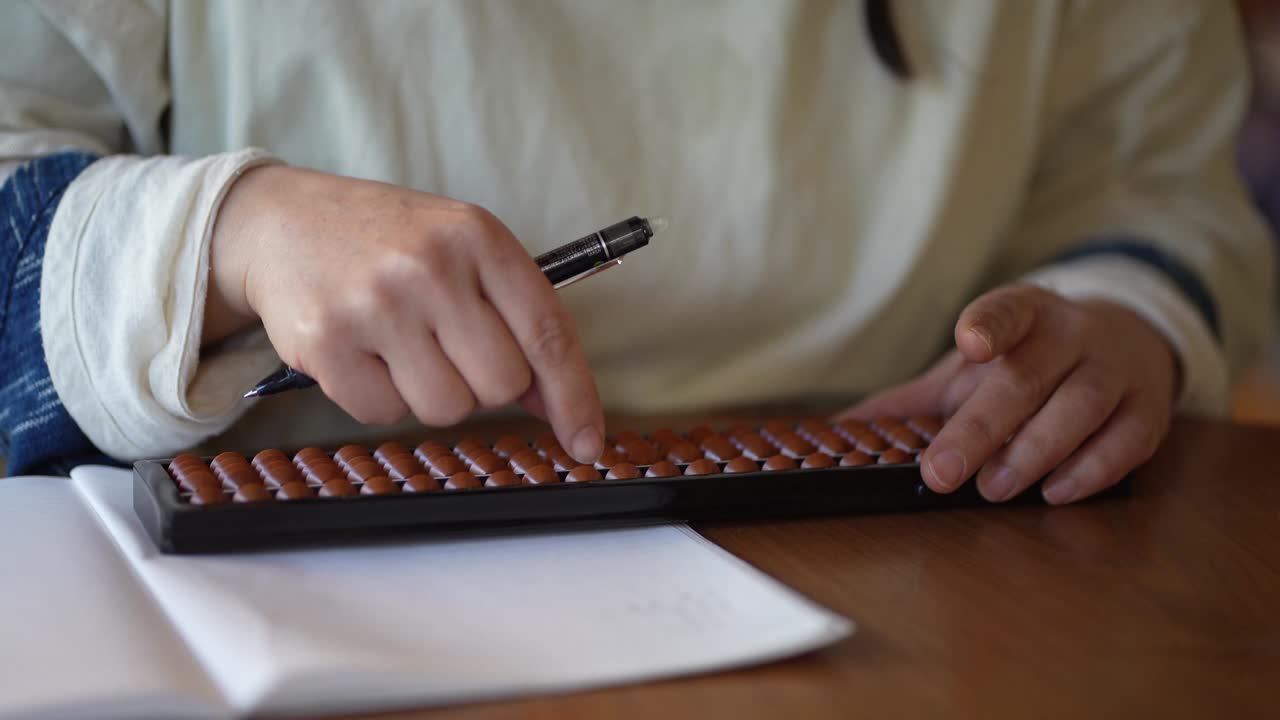Female using abacus