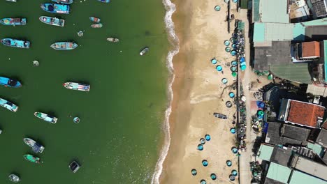 stunning top down drone shot over vietnamese basket boat leaving fishing harbor