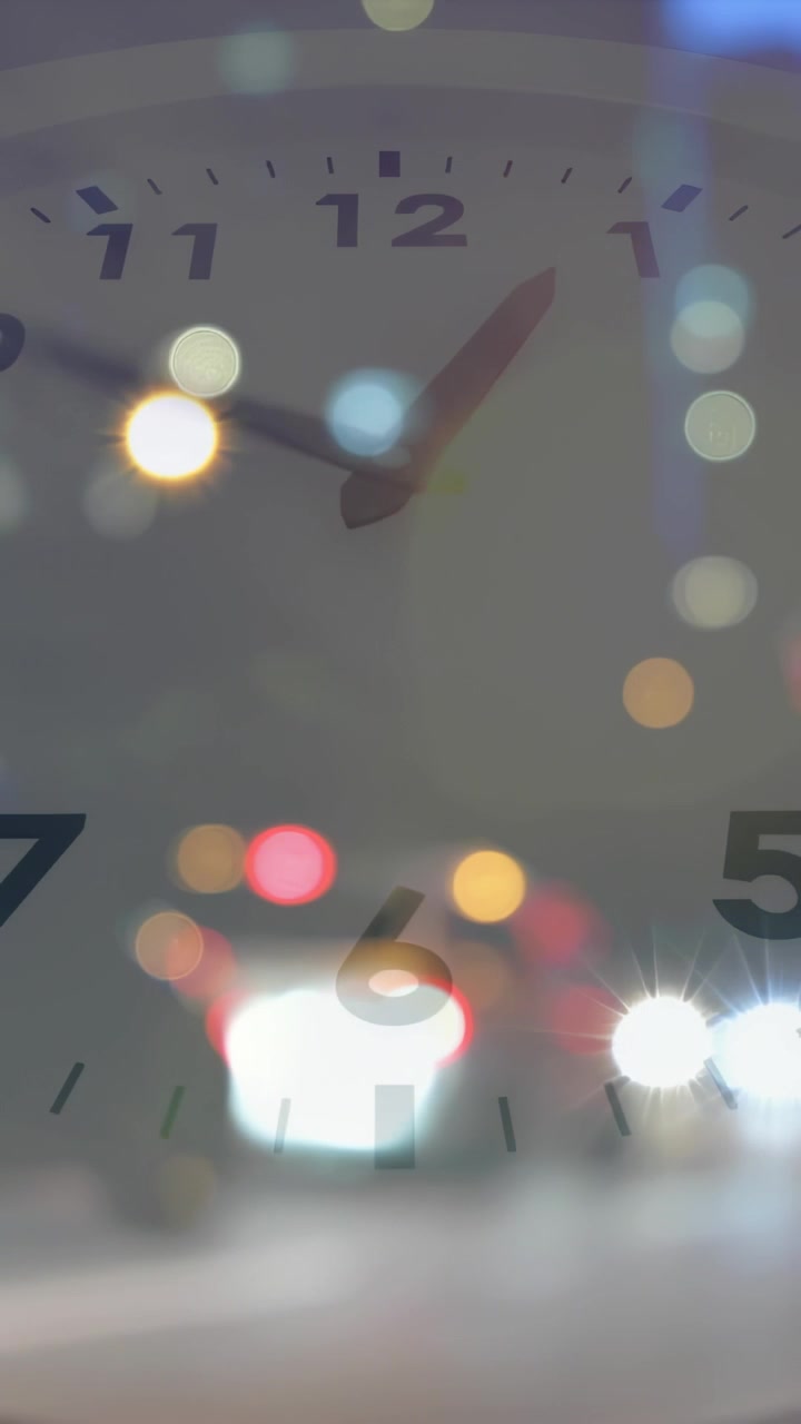 Vertical video: Tick causing hands turning right while bokeh lights shifting, showing time passing