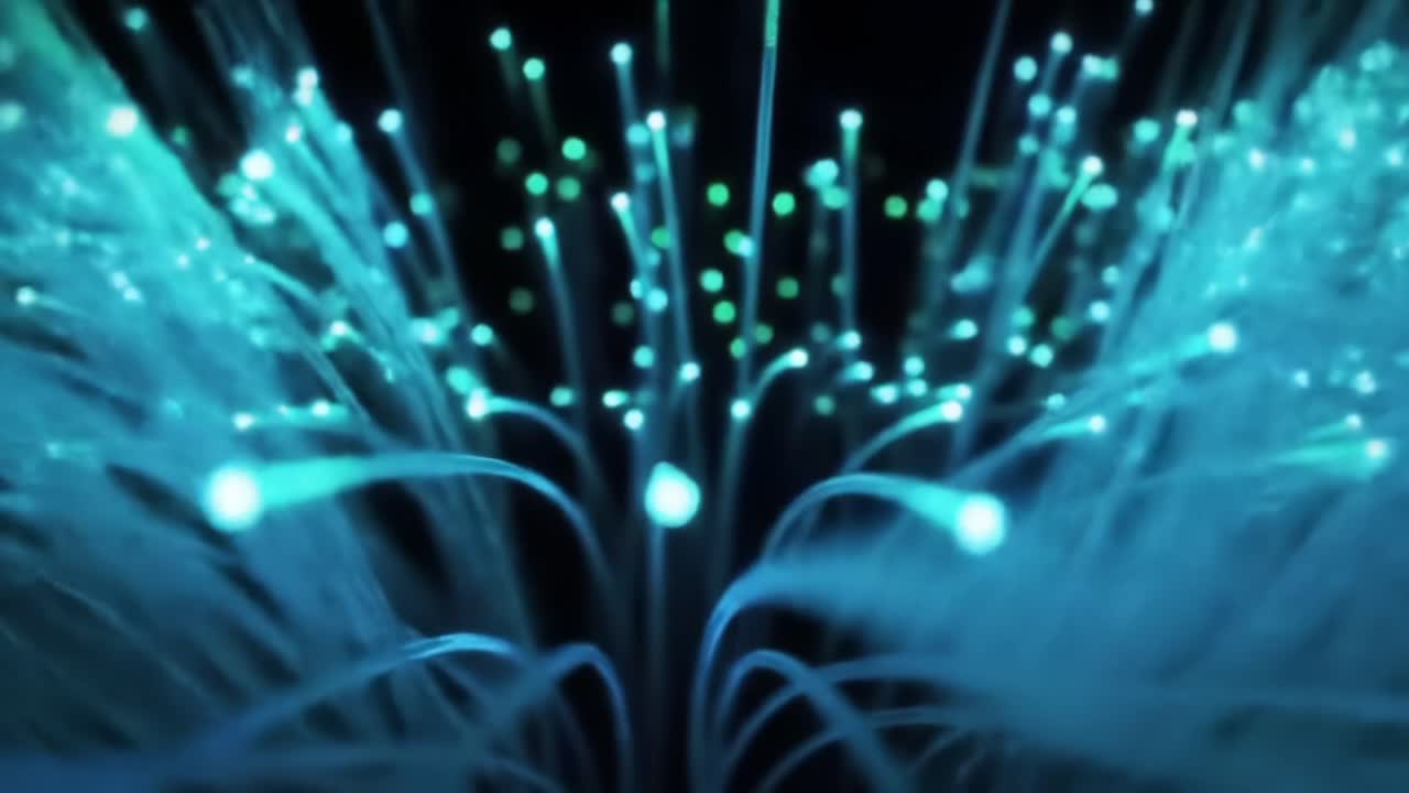 Captivating Display of Vibrant Fiber Optic Lights Emitting Brilliant Turquoise and Cyan Hues, Showcasing the Elegance of Advanced Illumination Technology in Motion