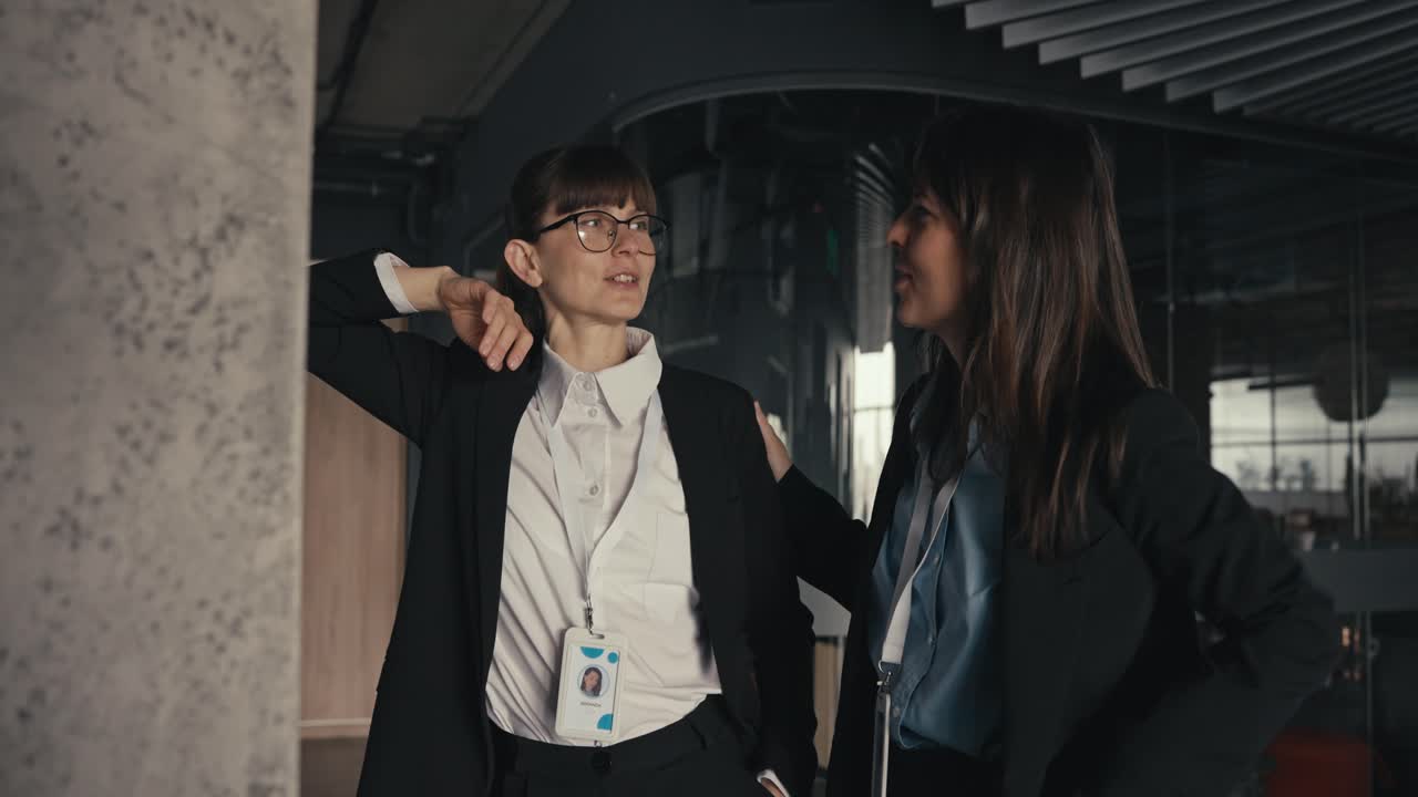 Two Businesswomen Discussing Plans in an Office