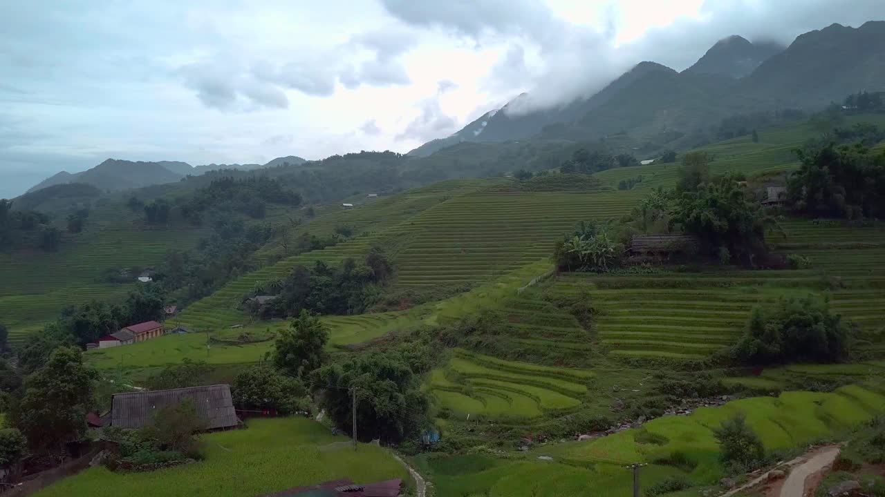 Epic footage of a rice field in Vietnam Sapa with a motorbike driving on a street