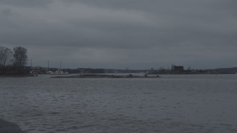 border patrol motor boat goes around the shoreline