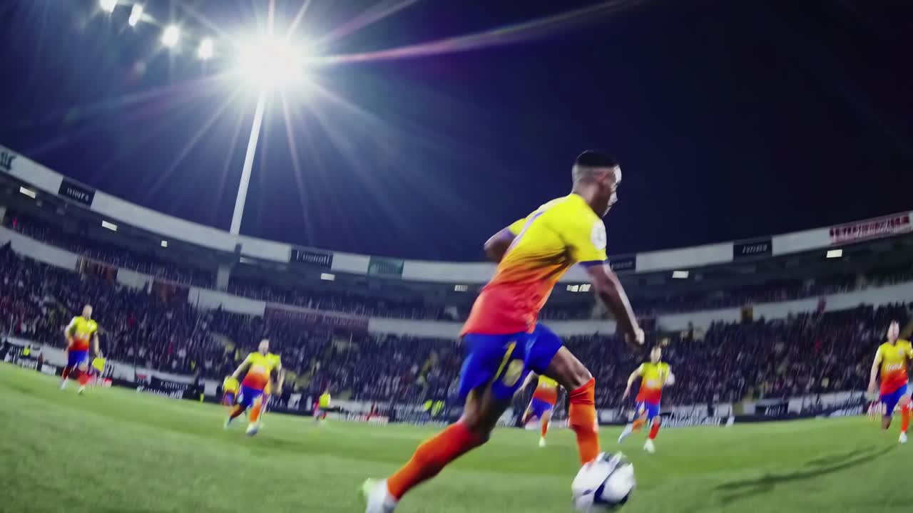 Dynamic low-angle shot of soccer players in action during a match, capturing intense movement